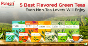 A selection of the best flavored green teas including mint, lemon ginger, tulsi, jasmine and apple cinnamon, served in cups with fresh ingredients placed around them.